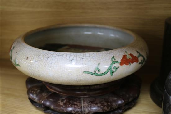 Three Chinese hardwood stands and three bowls